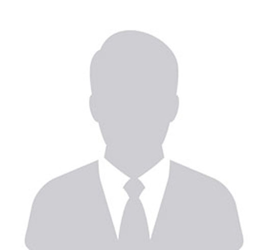 placeholder-male Gray silhouette of a person wearing a suit and tie, set against a plain white background, commonly used as a placeholder for a profile photo.